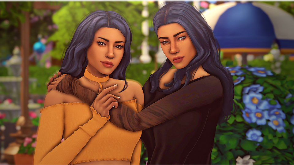 Two young women embrace in the computer game The Sims.