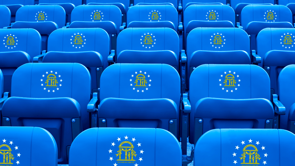 An illustration of sporting seats decorated with the Georgia state seal