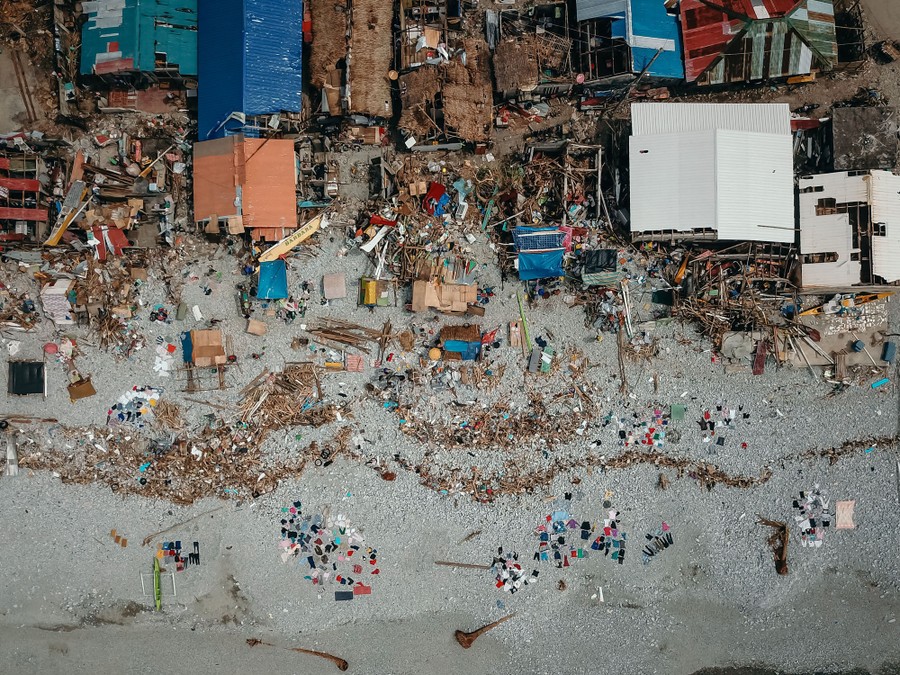An aerial view of a beach neighborhood heavily damaged by a storm.
