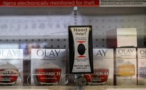 Olay products behind a plastic barrier