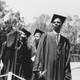 College students wearing caps and gowns, during a graduation ceremony in 1991. 
