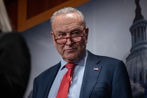 Chuck Schumer looks to the side during a press conference