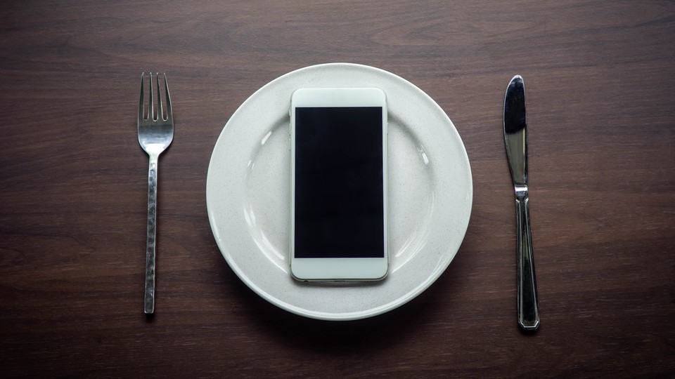 An empty plate with an iPhone on it