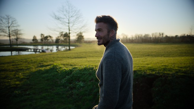 David Beckham standing on a field