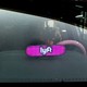 A car windshield with a light-up Lyft sign