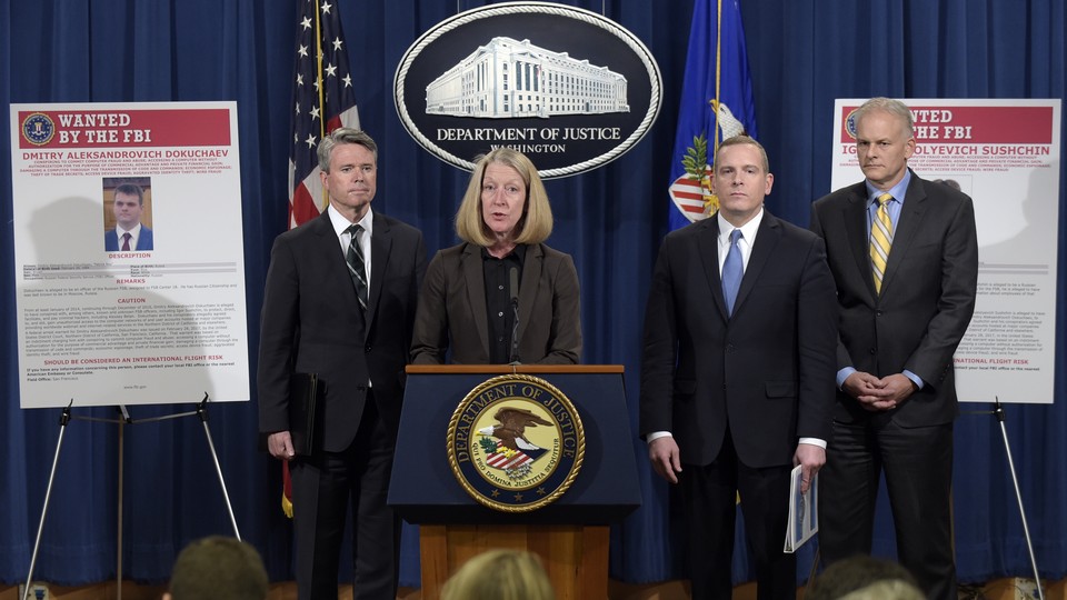 The Justice Department announced charges against four defendants, including two officers of Russian security services, for a mega data breach at Yahoo.