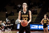 Caitlin Clark playing basketball