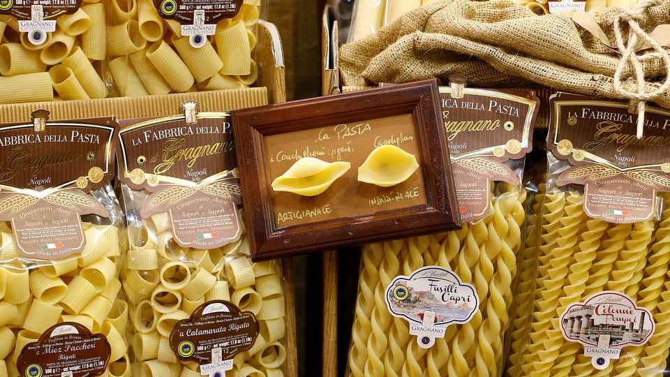 Various pasta shapes in small plastic packages
