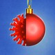 An illustration of a Christmas ornament and a virus particle