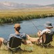photo of two men fishing next to each other