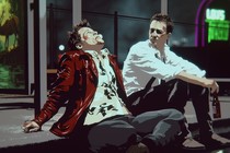 scene of Tyler Durden and the Narrator from "Fight Club" sitting on a curb