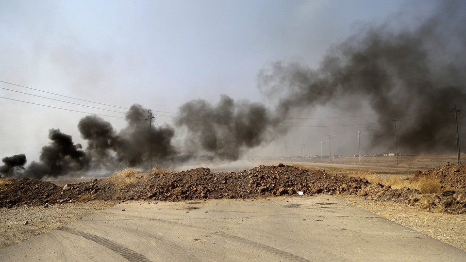Smoke rises from ISIS positions after an airstrike by coalition forces in Khazer, a village about 30 kilometers (19 miles) west of Mosul, Iraq.