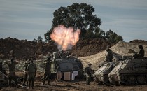 Photo of Israeli soldiers around a mortar launcher firing toward Gaza from Be'eri, Israel, on Tuesday, October 17, 2023.