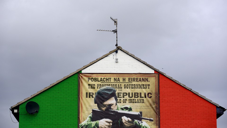 A mural in the Ardoyne area of North Belfast displaying an image of an IRA gunman
