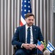 J.D. Vance sits in front of an American flag with small American and Israeli flags in front of him.