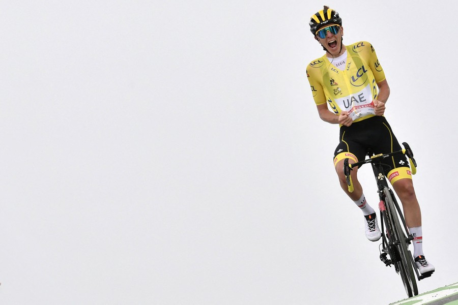 A Tour de France rider reacts as he crosses the finish line.