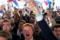 Supporters of the far-right National Rally celebrate the European election results in Paris on June 9.