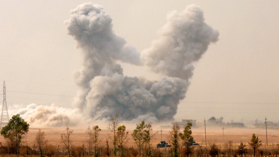 Smoke rises after an U.S. airstrike, while the Iraqi army pushes into Topzawa village during the operation against Islamic State militants near Bashiqa, near Mosul, Iraq October 24, 2016. 