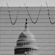 an image of the US Congress in front of a barbed wire fence
