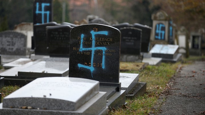 Graves desecrated with swastikas in a Jewish cemetery in France in February 2019