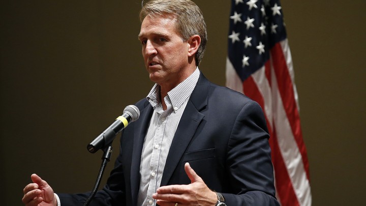 Senator Jeff Flake speaking into a microphone