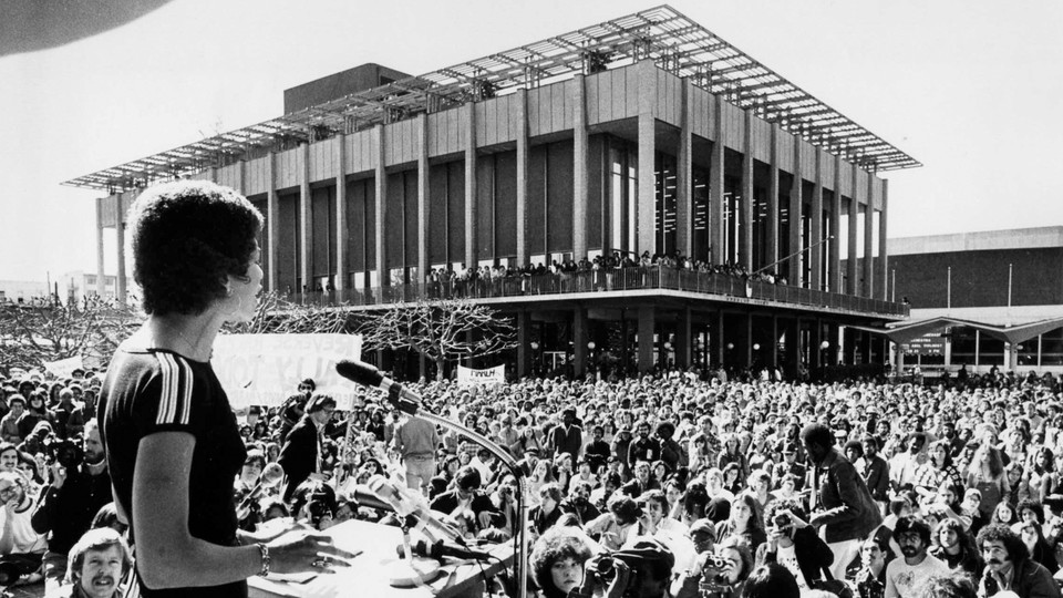 A black and white photograph of a large rally on affirmative action