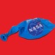 A deflated balloon with the NASA logo on it.