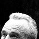 Black and white photo of the top half of Robert F. Kennedy Jr.'s head against a black background