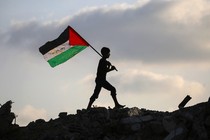 Boy holding Palestinian flag