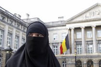 A woman wearing the niqab is pictured outside the Belgian Parliament in Brussels on April 26, 2010. 