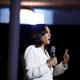 Kamala Harris speaks into a microphone.