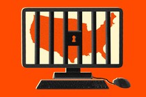 A desktop computer with the continental U.S. behind jail bars on its screen