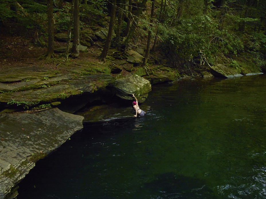 woman existing a river