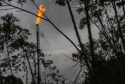 Gas flame burns at the top of an oil well in Colombia.