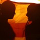 A photo of two girls standing behind the Union Jack