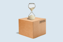 An illustration of a cardboard box with an hourglass on top