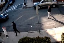 Plainclothes immigration law enforcement officers approach a student in a hijab to detain her