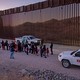 Border Patrol agents prepare to transport migrants.
