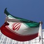 An Iranian flag flutters in front of the United Nations headquarters.
