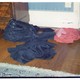 jeans and shirts crumpled on the floor