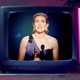 A TV playing different clips of Academy Award winners' acceptance speeches