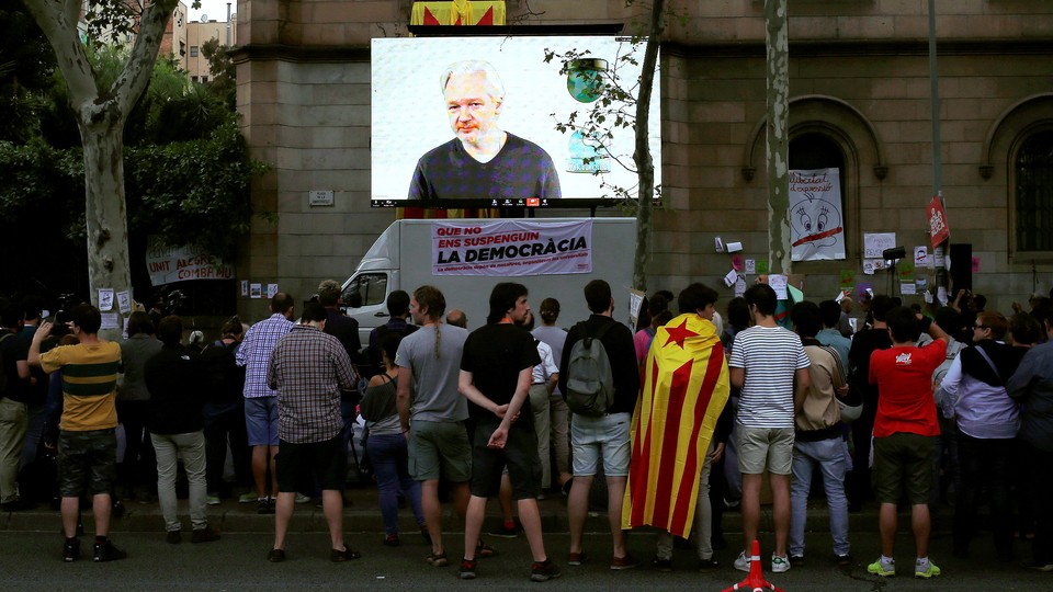 Via video conference, Julian Assange addresses supporters of the Catalonian independence referendum in 2017.
