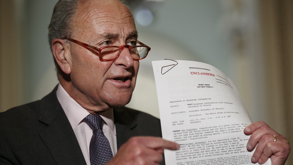 Senate Minority Leader Chuck Schumer of New York points to a copy of a White House–released rough transcript of a phone call between President Donald Trump and the president of Ukraine.
