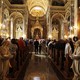 The inside of a Basilica filled with ornate and religious arches, paintings, and statues