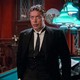 Tim Curry as Wadsworth in "Clue" standing in the billiards room