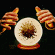 Hands animated over a crystal ball showing Covid virus.