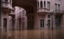 Floodwater covers the courtyard of a building.