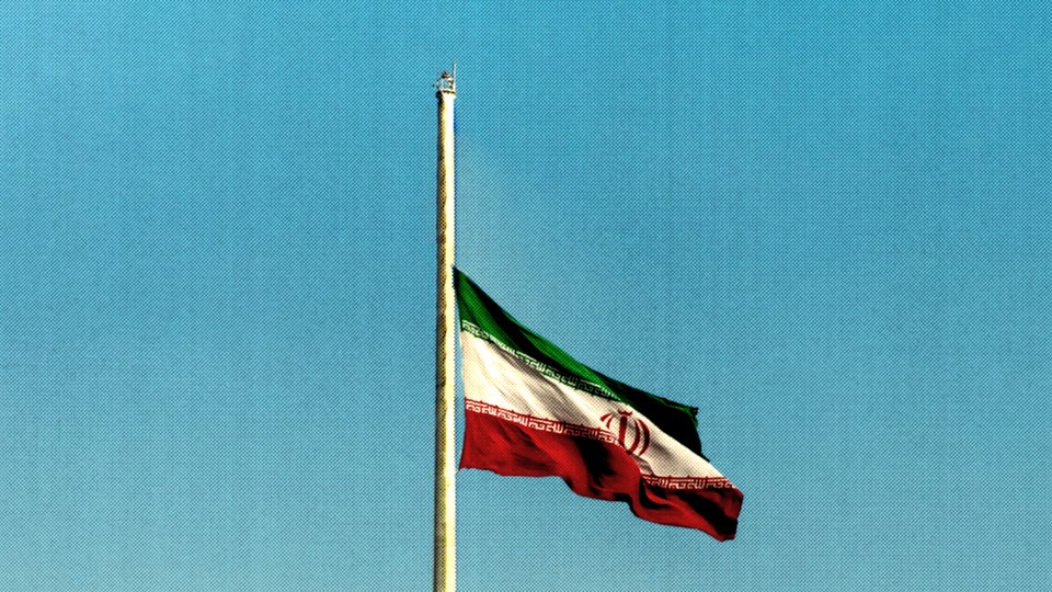 An Iranian flag at half mast