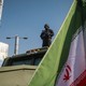 Iran military official with flag