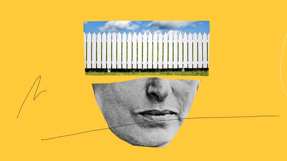 White picket fence and bottom half of a woman's face